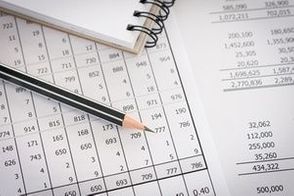 Balance sheet ,pencil, notebooks on desk of auditor to accountancy internal audit.